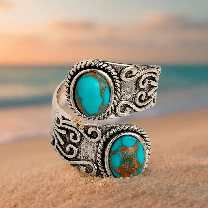 Anillo elegante vintage con banda cruzada y turquesa