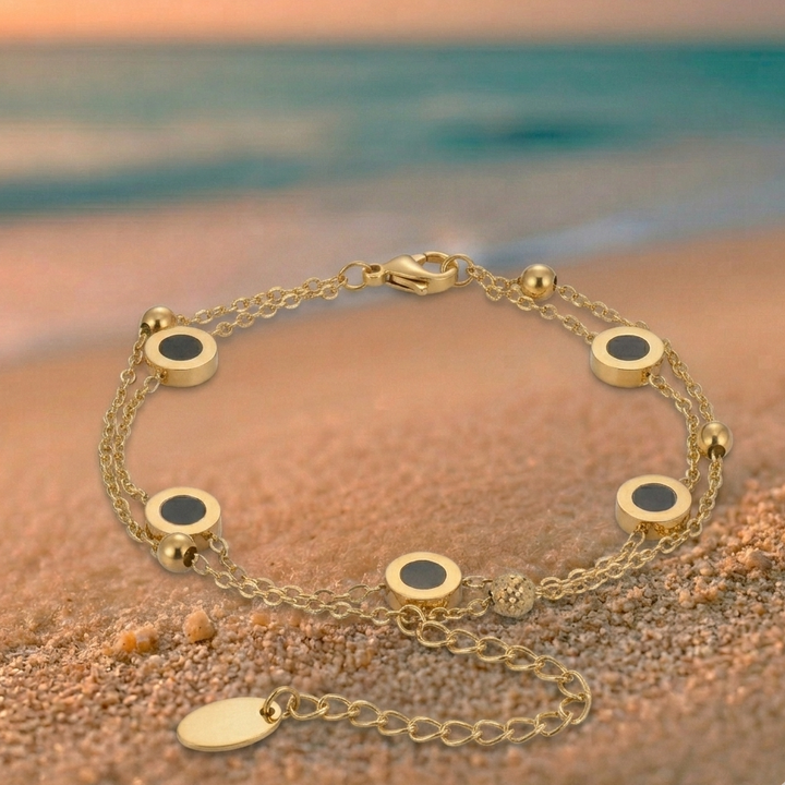 Carla – Pulsera suave con elementos redondos contrastantes.