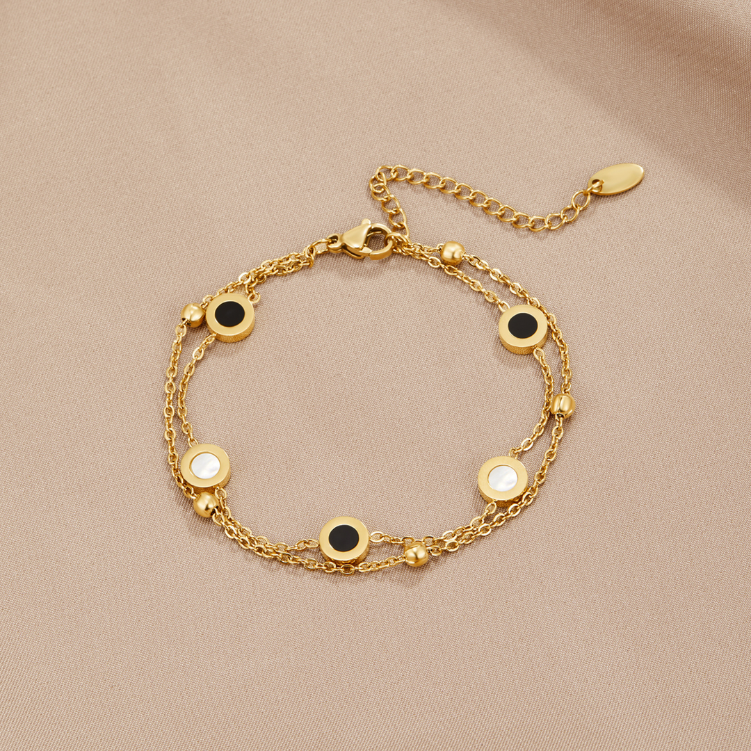 Carla – Pulsera suave con elementos redondos contrastantes.
